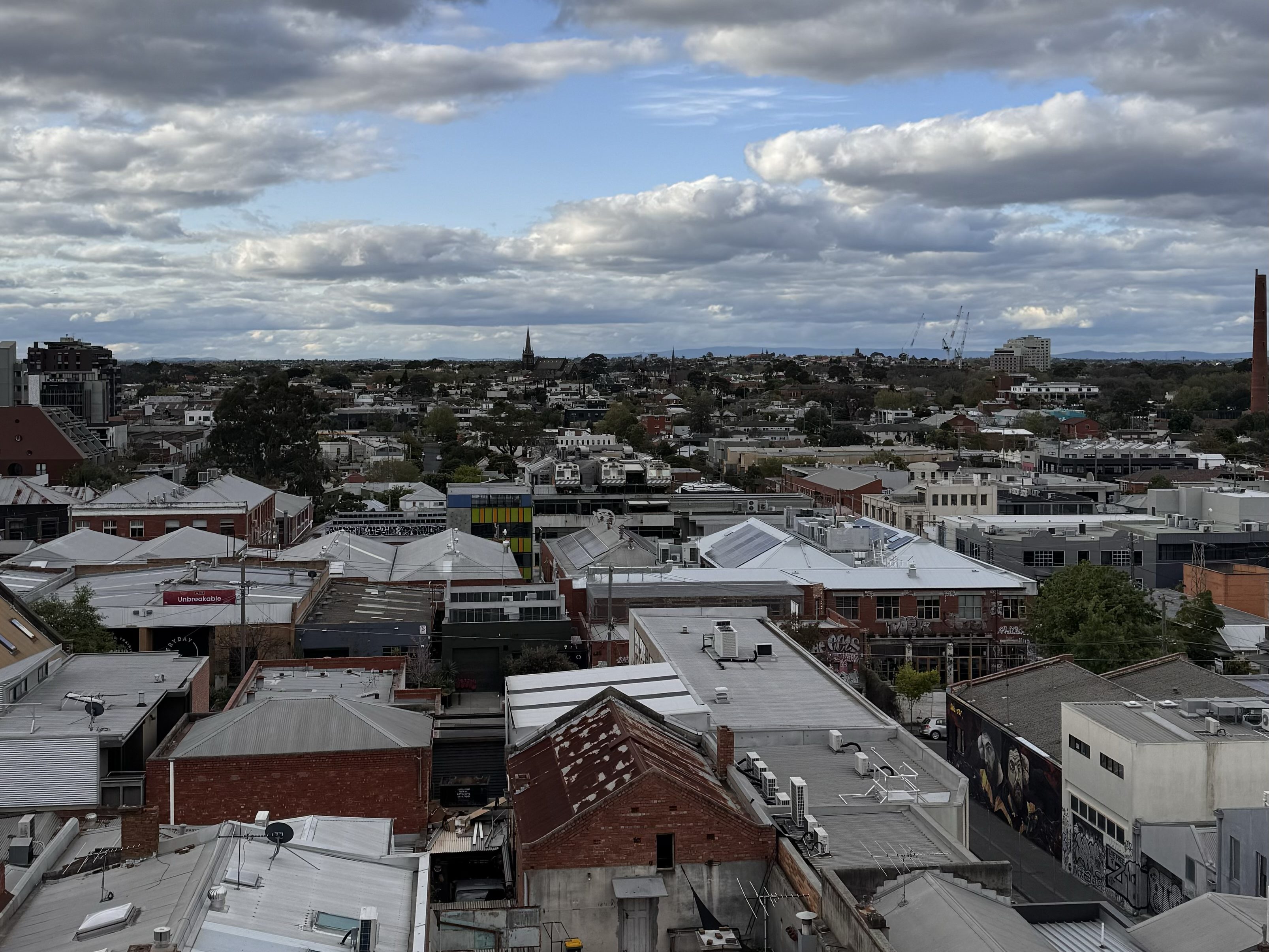 Panoramic view of sky and city of Melbourne from hotel rooftop